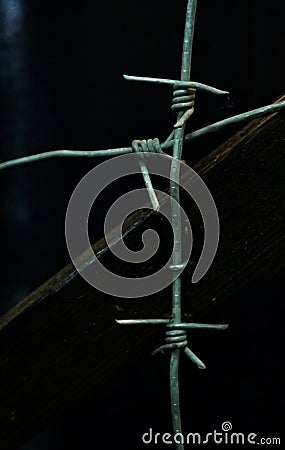 Barbed wire on a dark background Stock Photo