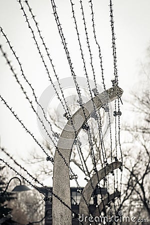 Auschwitz / Oswiecim / Poland - 02.15.2018: Barbed wire fence around a concentration camp. Editorial Stock Photo