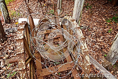 Barbed Wire And Rusted Ancient Machinery Stock Photo