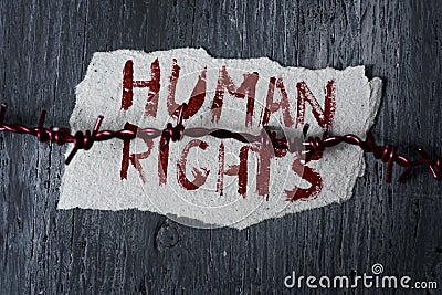 Barbed wire and text human rights Stock Photo