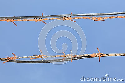 Barbed wires in sky Stock Photo