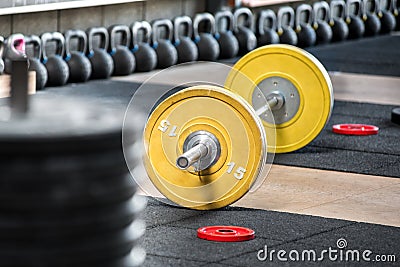 Barbell on the floor in gym Stock Photo