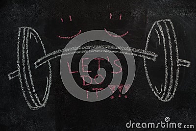 Barbell and Let`s do it text on black chalkboard Stock Photo