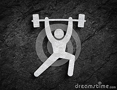 Barbell weightlifting training symbol stone wall background Stock Photo