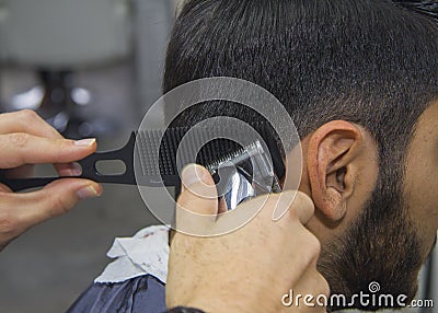 Barber cutting hair Stock Photo