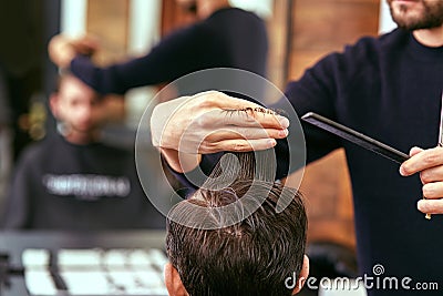 Barber makes men haircut at the beauty salon Stock Photo