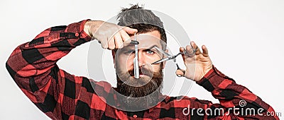 Barber scissors and straight razor, barbershop. Mens haircut, shaving. Bearded man, long beard, brutal, caucasian Stock Photo