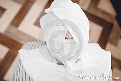 Barber steam face skin of man with hot towel before royal shave in Barbershop Stock Photo