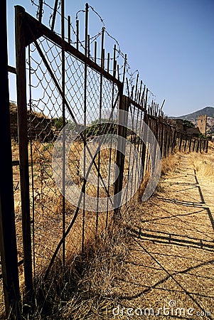 Barbered fence protects restricted zone Stock Photo