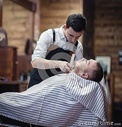 Shaving beard trimmer at the hairdresser Stock Photo