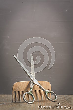 Barbershop concept. Old style. Hairbrushes and a scissors on a gray background. Selective focus Stock Photo