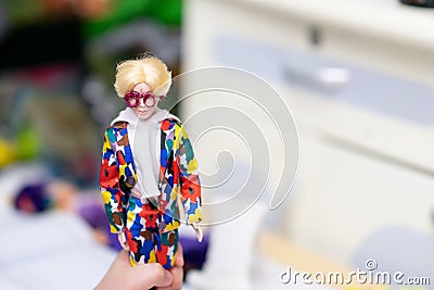 Barbie boy doll in kid hand playing Editorial Stock Photo