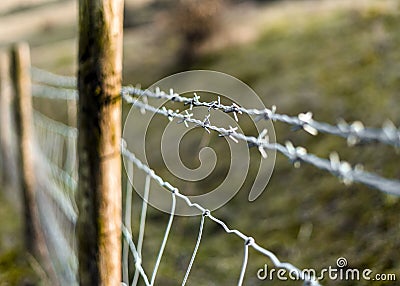 Barbwire fence at a private property Stock Photo