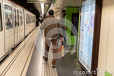 People in Metro of Barcleona without tourists in times of the Covid in 2021 Editorial Stock Photo