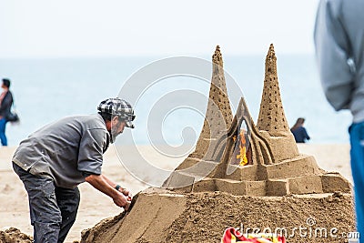 Sand sculptor working at La Barceloneta Beach in Barcelona Spain Editorial Stock Photo