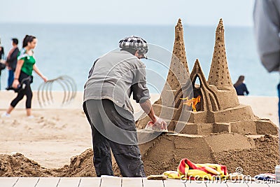 Sand sculptor working at La Barceloneta Beach in Barcelona Spain Editorial Stock Photo