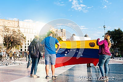 Barcelona, Spain - 30 april 2019: young venezuelans protest in Editorial Stock Photo