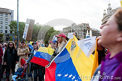 Barcelona, Spain - 30 april 2019: young venezuelans protest in Editorial Stock Photo