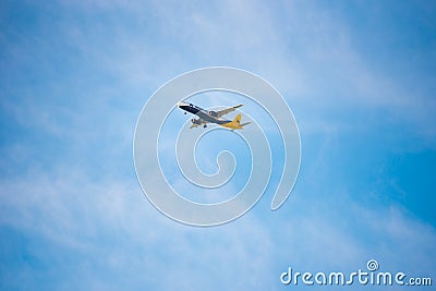 BARCELONA, SPAIN - AUGUST 20, 2016: Airplane Monarch Airbus 321 in the sky. The monarch is a British airline. Copy space. Editorial Stock Photo