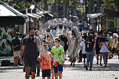 Barcelona, Spain, August 8, 2020: Family wearing protective medical masks for prevent virus Covid-19 in Barcelona, Spain, Europe Editorial Stock Photo