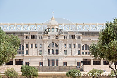 Montjuic Olympic Stadium, built in 1927. Clock above empty tribunes on sport arena Editorial Stock Photo