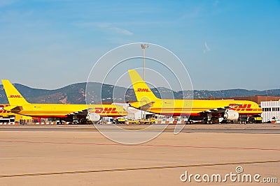 BARCELONA, SPAIN - AUGUST 20, 2016: Yellow cargo planes Boeing 757 from the logistics courier company DHL. Copy space for t Editorial Stock Photo