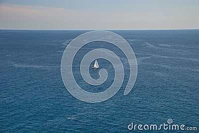 Barcelona, Spain - 18.08.2019: Beautiful white sailing yacht in the blue huge sea Stock Photo