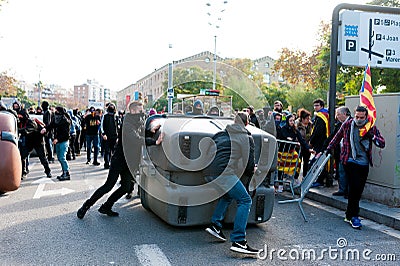Barcelona, Spain - 21 decemer 2018: young catalan independists, called Cdr, clash with police during a cabinet meeting in Llotja Editorial Stock Photo