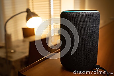 Barcelona, Spain. January 2019: Selective focus on Amazon Echo Plus smart Home device turning on a floor lamp Editorial Stock Photo