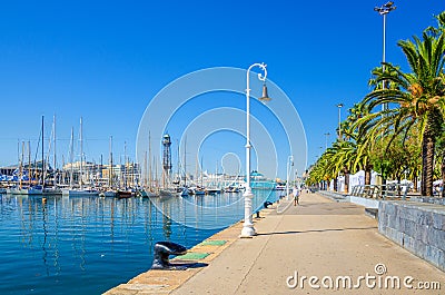 Promenade embankment of Barcelona with moored yacht boats in port Editorial Stock Photo
