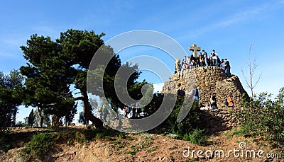 Tourists in Barcelona in the Park Guell at Calvary three crosses. Editorial Stock Photo