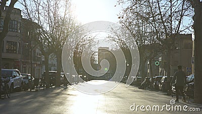 Barcelona, Spain - May, 2018: Lively Park alley with houses. Art. View of residential area with asphalt alley, trees Editorial Stock Photo