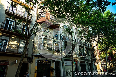 Barcelona, Spain - May 28 2022: Lovely Little Balcony In The Old Town In The Gothic Quarter With Flowers In Pots. Trees Grow Editorial Stock Photo