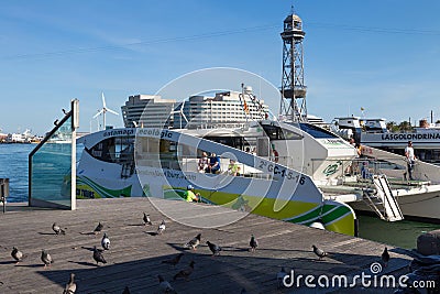 BARCELONA, SPAIN - MAY 16, 2017: View of the touristic passenger catamaran on the pier in center of Barcelona in sunny day Editorial Stock Photo