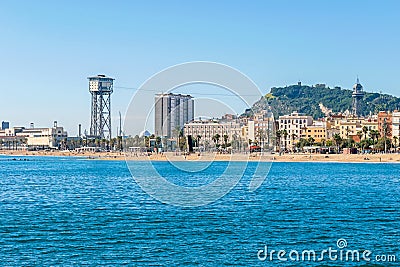 The aerial tramway with its two towers, Torre Sant Sebastia and Torre Jaume I in Barcelona, Spain Editorial Stock Photo