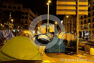 Barcelona, Spain - 5 november 2019: tents occupy plaÃ§a universitat in barcelona at night with catalan flags. separatists students Editorial Stock Photo