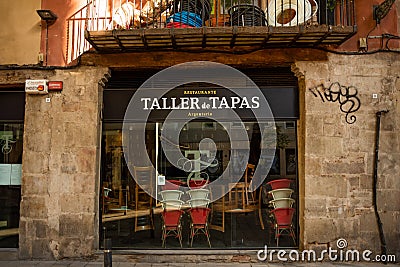 Barcelona, spain - 20 november 2020: window of empty closed bar and tapas restaurant due to corona virus pandemic lock down. covid Editorial Stock Photo