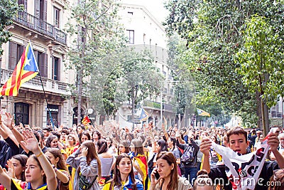 BARCELONA, SPAIN - OCTOBER 18, 2019: A crowd of peope standing on Placa Catalunia during protests in Catalonia. Pro-Catalan Editorial Stock Photo