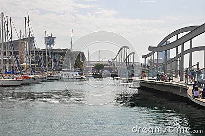 BARCELONA, SPAIN - SEPTEMBER 2016: People having rest, dining and watching cruise yachts. Aquarium Barcelona and funicular. Couple Editorial Stock Photo