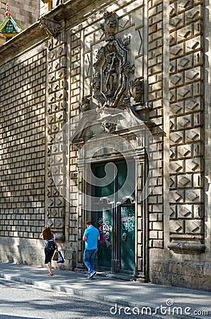 People walk along pedestrian street La Rambla near church of Our Lady of Bethlehem, Barcelona, Spain Editorial Stock Photo