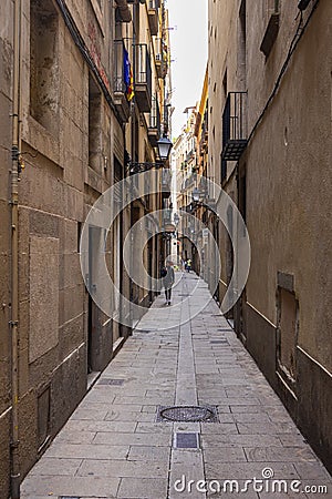 Barcelona, Spain - September 23, 2021: View into the narrow streets of the city. Beside the big boulevards narrow alleys Editorial Stock Photo