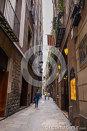 Barcelona, Spain - September 23, 2021: View into the narrow streets of the city. Beside the big boulevards narrow alleys Editorial Stock Photo