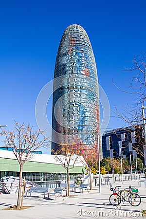 Barcelona Torre Agbar tower in daytime iconic modern designed skyscraper - tall building city scene Editorial Stock Photo