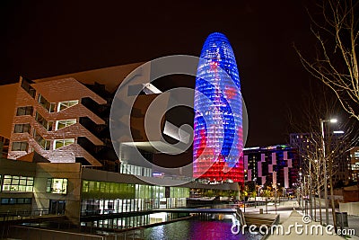 Barcelona Torre Agbar tower at night iconic modern designed skyscraper - tall building Editorial Stock Photo