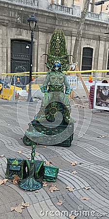 Barcelona street artist performing as a alien Editorial Stock Photo