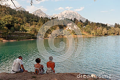 Barcis, Pordenone, Italy - August 12, 2018: people relax on the picturesque lakeside Editorial Stock Photo