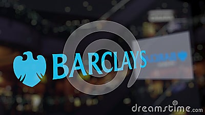 Barclays logo on the glass against blurred business center. Editorial 3D rendering Editorial Stock Photo