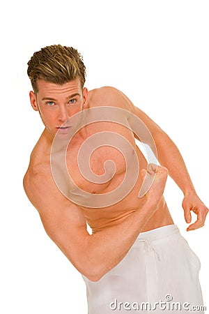 Bare-chested man showing muscles Stock Photo