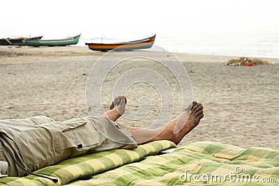 Bare foots relaxing in beach Stock Photo