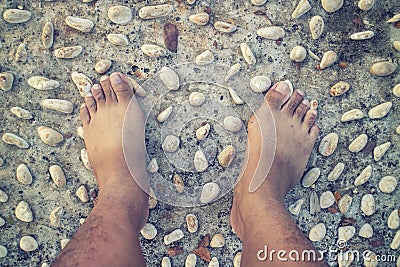 Barefoot at cement stone track for massage the soles of the feet Stock Photo